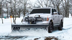 Silver pickup truck with SnowDogg snow plow