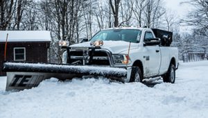 White pickup truck with SnowDogg snow plow